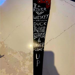 Painted saw about river, duck and whiskey